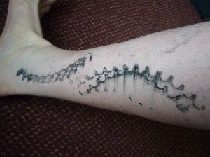 DC cant resist a bike tattoo